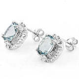 2.838 ct Blue Topaz with a fine border of Diamonds, Sterling Silver Stud Earrings