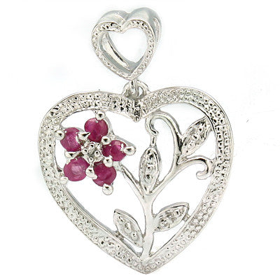 A heart shaped solid silver pendant with a flower design and ruby petals in the centre of the heart.