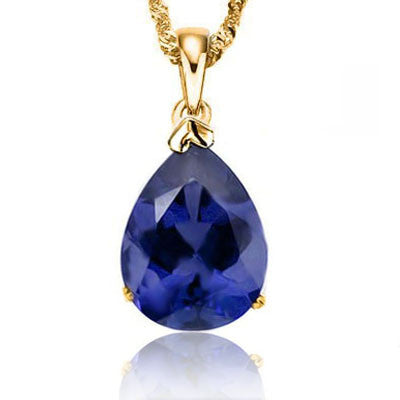 A stunning 1/2 carat royal blue pear shaped, lab created tanzanite 10KT yellow gold pendant with matching 18" chain. The gemstone is approximately 6mm by 4mm in size
