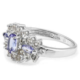 side view of of a lovely tanzanite, white topaz and diamond sterling silver ring