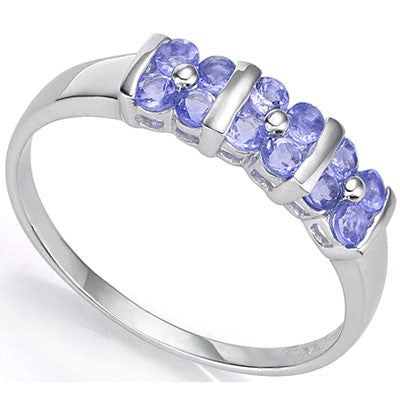 An unusual group of three four petal genuine tanzanite flowers along the band of this sterling silver trilogy ring.
