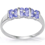 A lovely view of the tanzanite flowers on this solid silver trilogy ring 