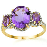 A truly stunning 2.50 Carat (total weight) Trilogy Oval Cut Genuine Amethyst and encrusted with 22 small round cut Genuine Diamonds on a 10K Solid Gold Ring.